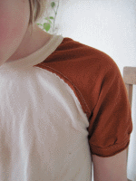 Child wearing a raglan sleeve shirt